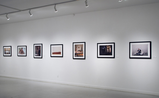Installation view: framed photographs from Beyond Success hung in a gallery